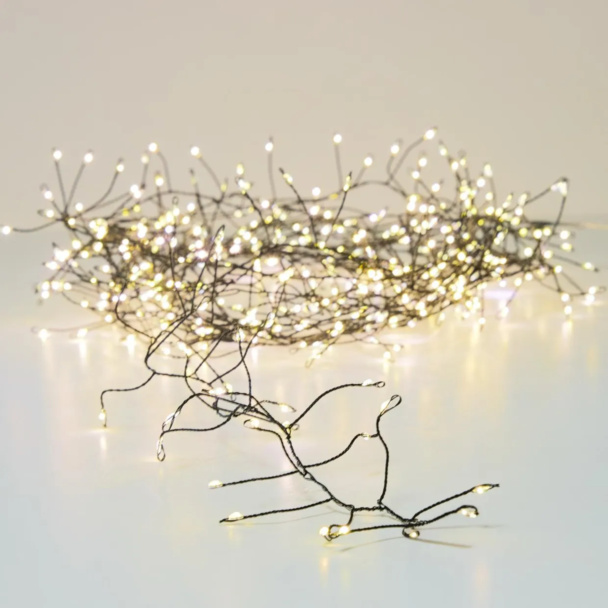 Guirlande lumineuse 12 m 960 Micro LED câble noir Luxe Blanc chaud