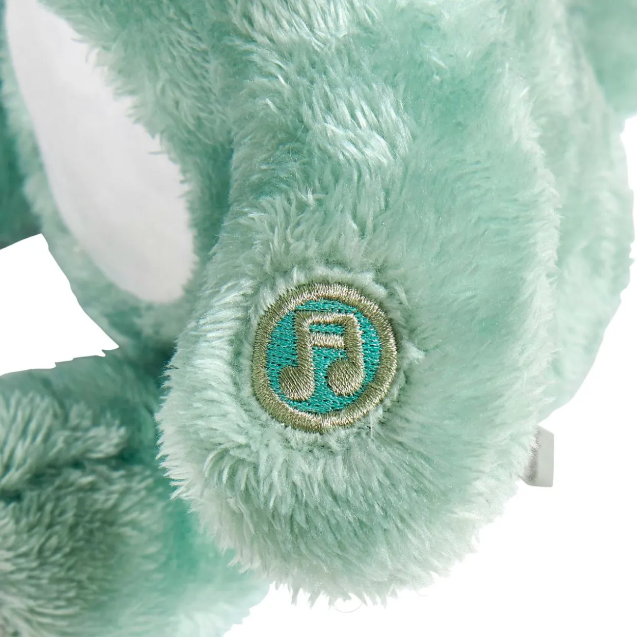 Peluche veilleuse et musicale bébé Dino Verte